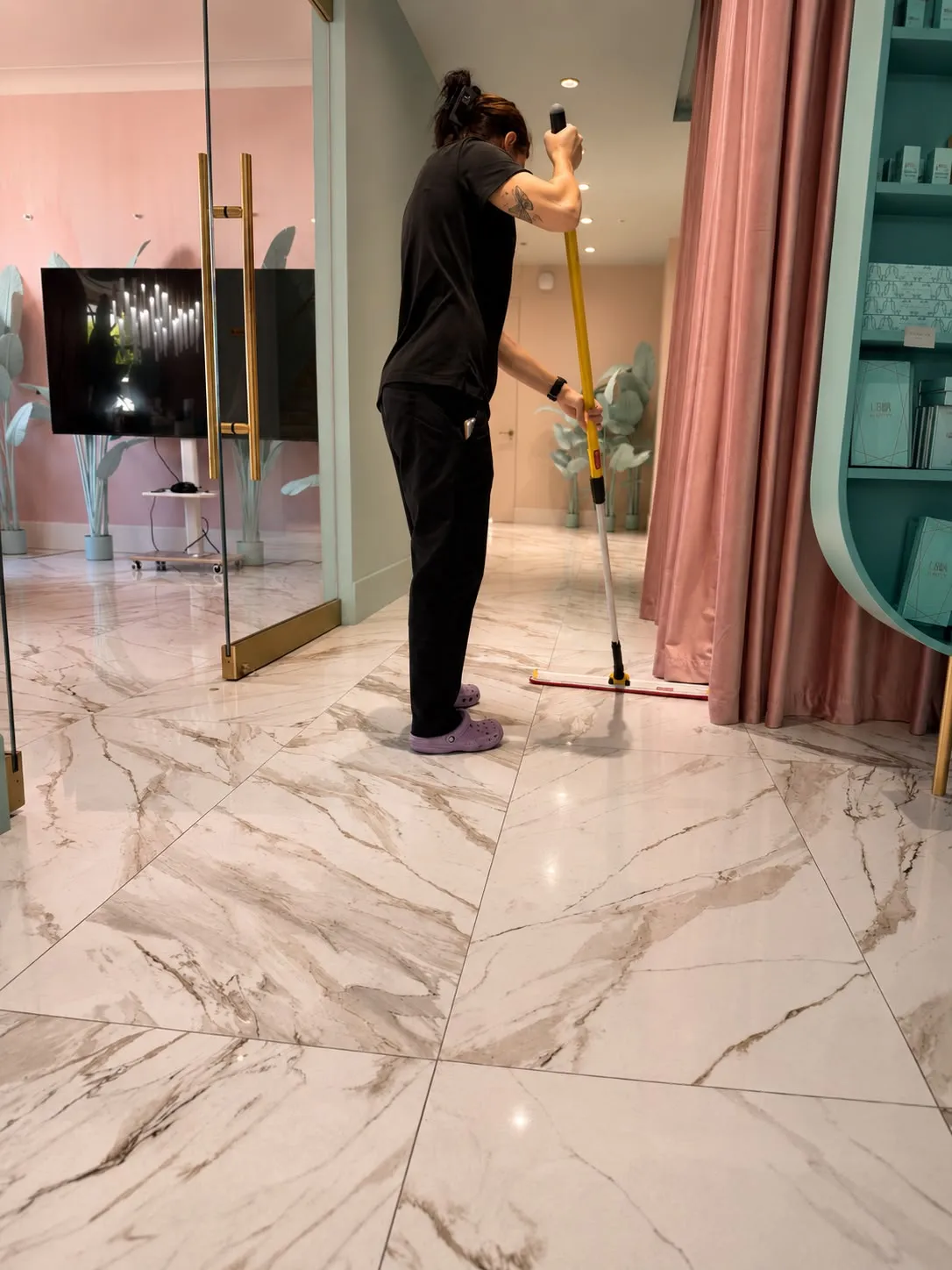 Finishing pass on polished marble floors at an Orange County beauty studio